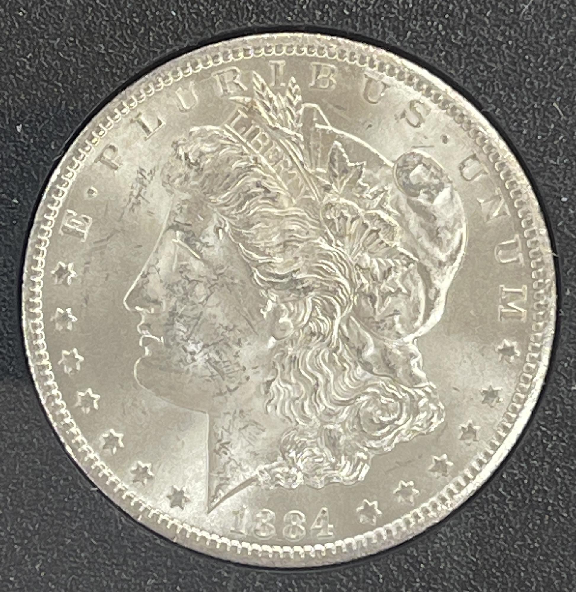 1884-CC Morgan Silver Dollar NGC MS 63 in GSA Hoard Holder